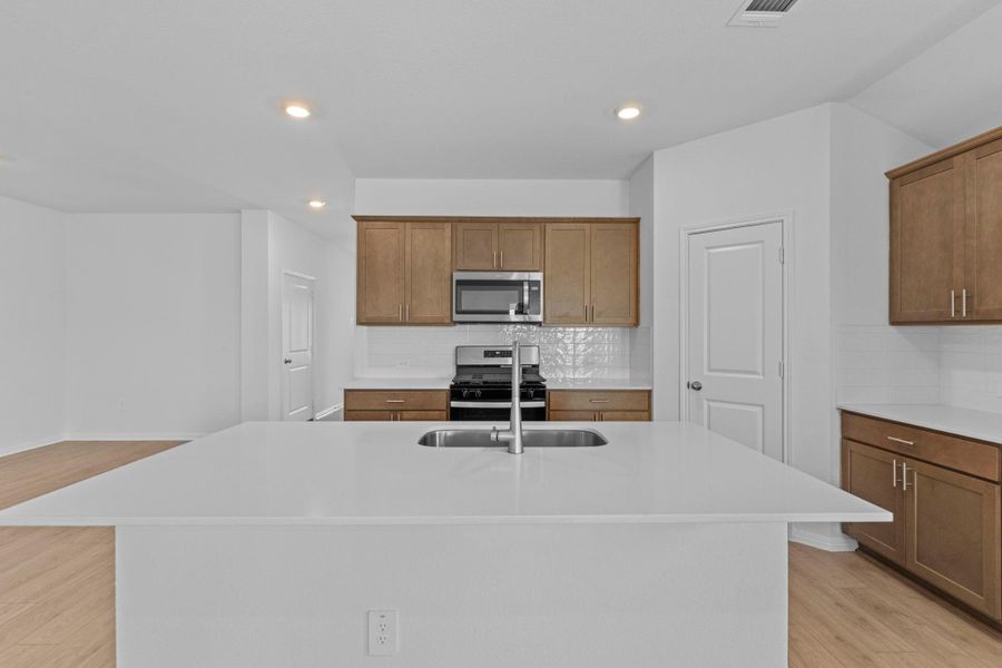 Furnished interior view inside a new home in Bar W Ranch, Leander (Image 7). Furnished interior view inside a new home in Bar W Ranch, Leander (Image 7).