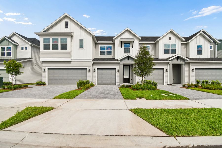 Front exterior of a new home in Preserve at The Cays – The Harbor Series, Daytona Beach, FL, highlighting curb appeal (Image 2). Front exterior of a new home in Preserve at The Cays – The Harbor Series, Daytona Beach, FL, highlighting curb appeal (Image 2).