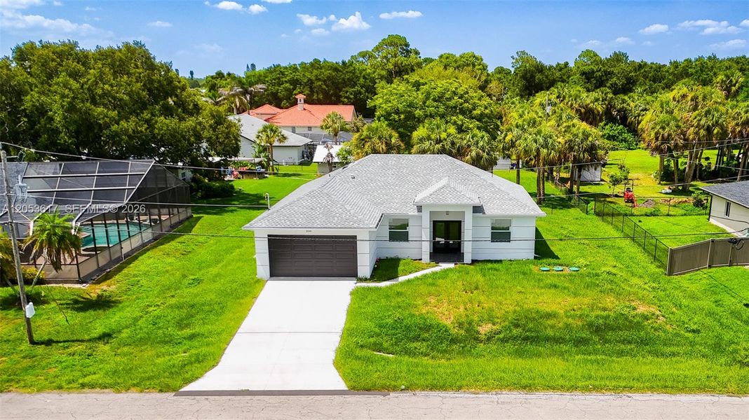 Front exterior of a new home in , Lehigh Acres, FL, highlighting curb appeal (Image 2).