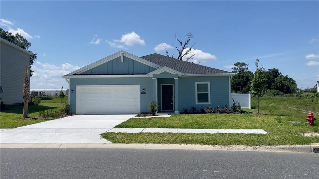 Front exterior of a new home in Heath Preserve, Ocala, FL, highlighting curb appeal (Image 1). Front exterior of a new home in Heath Preserve, Ocala, FL, highlighting curb appeal (Image 1).