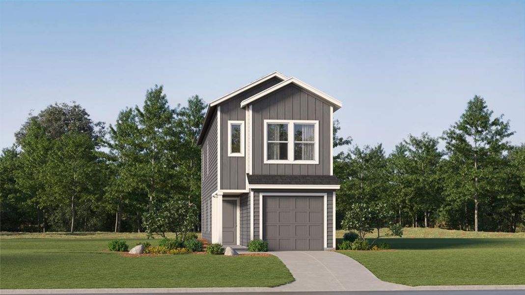 View of front of property with a garage and a front yard