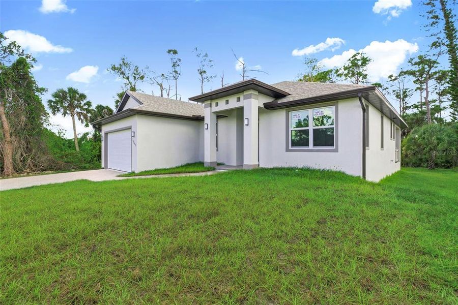 Front exterior of a new home in , Port Charlotte, FL, highlighting curb appeal (Image 27). Front exterior of a new home in , Port Charlotte, FL, highlighting curb appeal (Image 27).