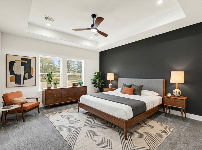 Spacious primary bedroom with accent wall (digitally staged photo) Spacious primary bedroom with accent wall (digitally staged photo)