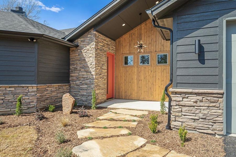 Natural flagstone pathway residing in clean intentional beds
