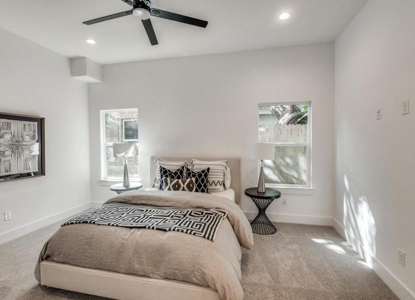 Bedroom featuring ceiling fan and carpet flooring