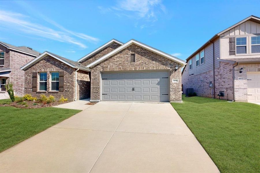 Front exterior of a new home in Mobberly Farms, Pilot Point, TX, highlighting curb appeal (Image 18).