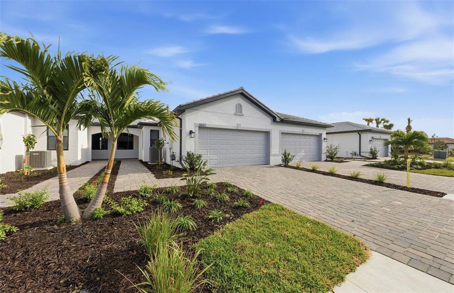 Front exterior of a new home in Talon Preserve on Palmer Ranch, Nokomis, FL, highlighting curb appeal (Image 19). Front exterior of a new home in Talon Preserve on Palmer Ranch, Nokomis, FL, highlighting curb appeal (Image 19).