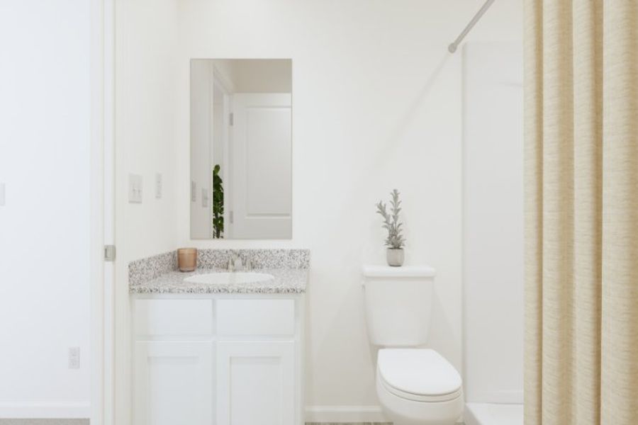 A bathroom with a toilet and sink.