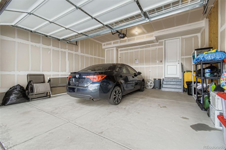 Large, drywalled garage.