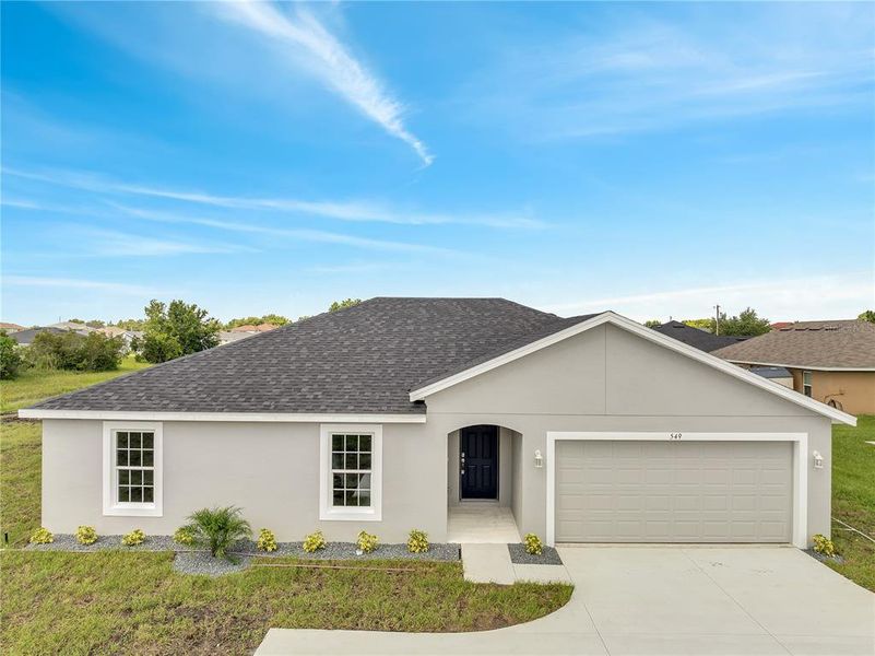 Front exterior of a new home in , Kissimmee, FL, highlighting curb appeal (Image 1).