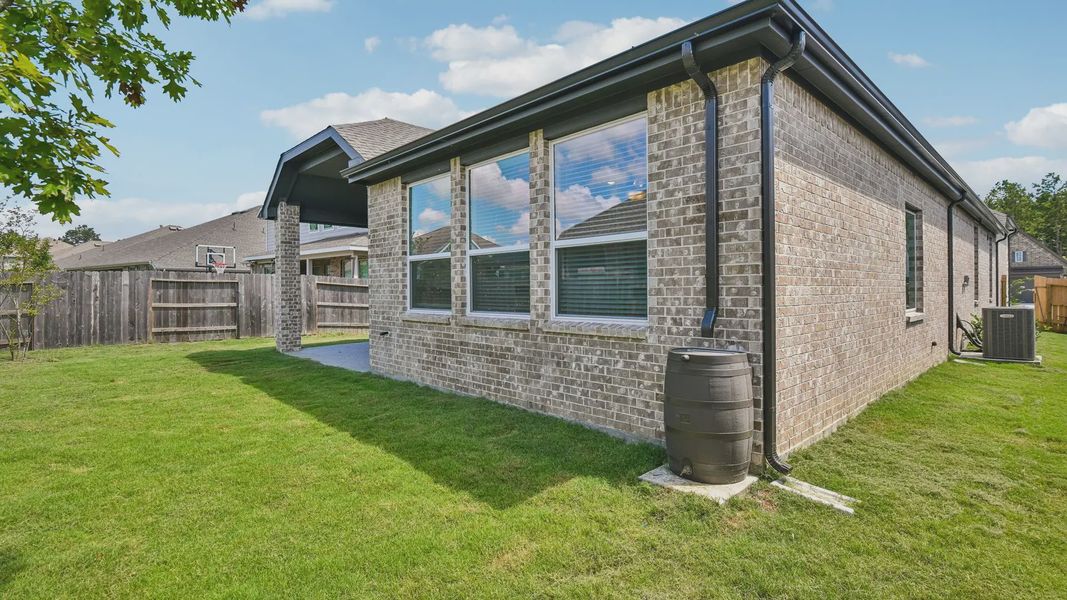 Exterior details and patio area of a home in Artavia, Conroe (Image 25).