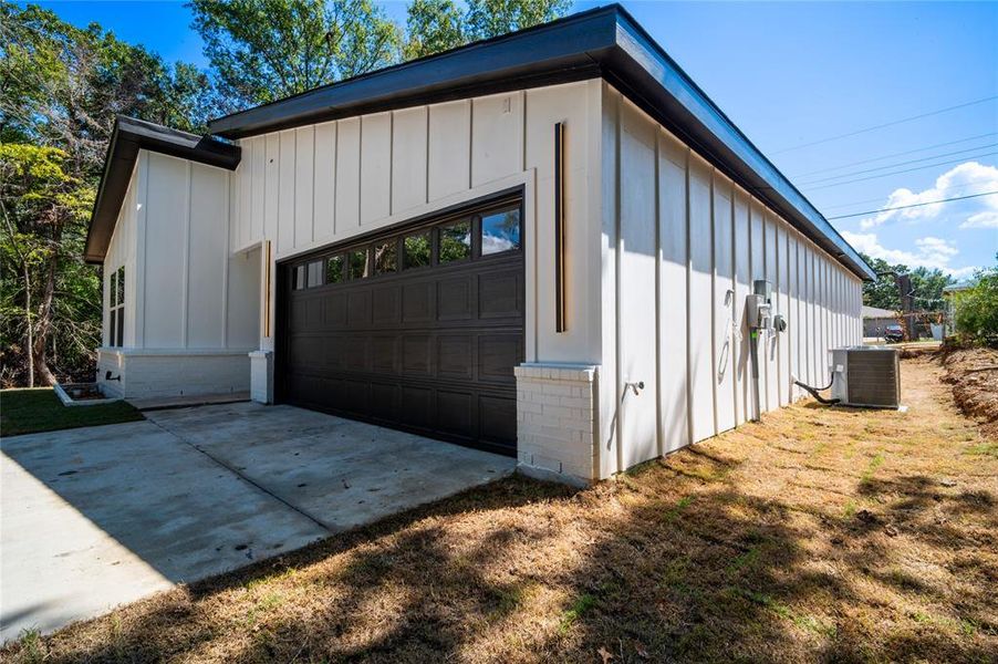 Garage featuring central AC unit