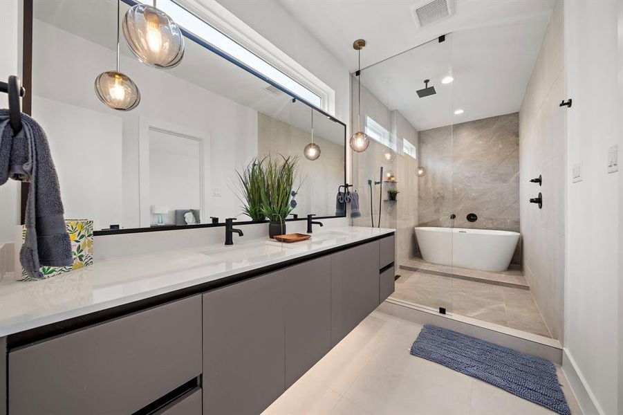 The elegant tub invites you to unwind in style, offering a tranquil escape in the comfort of your own home.This bathroom offers the perfect balance of luxury and comfort, ideal for those seeking a high-end, peaceful retreat.