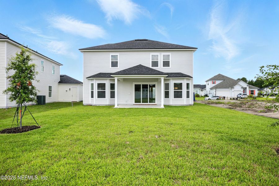 Front exterior of a new home in Silver Landing At Silverleaf, St. Augustine, FL, highlighting curb appeal (Image 1).