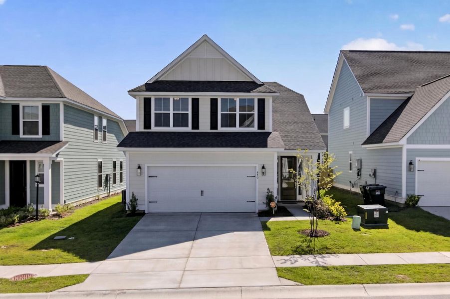 Front exterior of a new home in High Point at Foxbank, Moncks Corner, SC, highlighting curb appeal (Image 2). Front exterior of a new home in High Point at Foxbank, Moncks Corner, SC, highlighting curb appeal (Image 2).