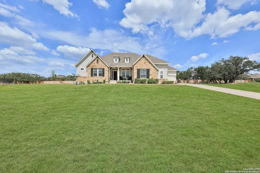 Front exterior of a new home in Megans Landing – Half-Acre Homesites, Castroville, TX, highlighting curb appeal (Image 2). Front exterior of a new home in Megans Landing – Half-Acre Homesites, Castroville, TX, highlighting curb appeal (Image 2).
