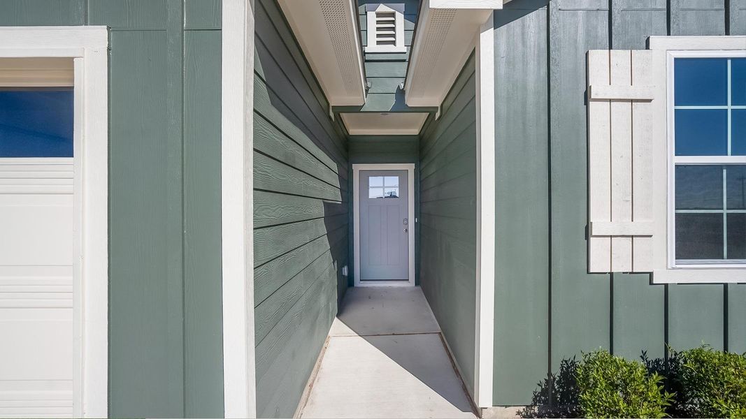 Exterior details and patio area of a home in Marigold, Kyle (Image 3).