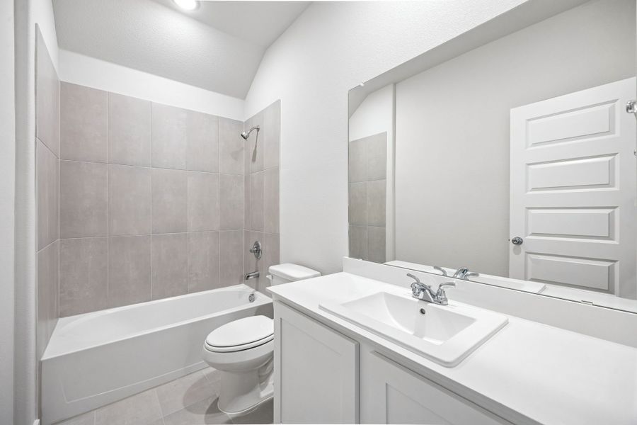 Bathroom in the Heisman home plan by Trophy Signature Homes – REPRESENTATIVE PHOTO