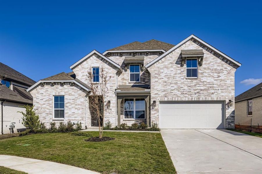 View of front of property featuring concrete driveway, a front yard, a garage, and brick siding View of front of property featuring concrete driveway, a front yard, a garage, and brick siding