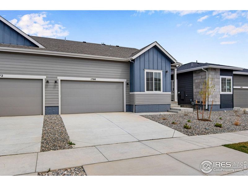 Front exterior of a new home in Westside Crossing Paired Homes, Berthoud, CO, highlighting curb appeal (Image 2). Front exterior of a new home in Westside Crossing Paired Homes, Berthoud, CO, highlighting curb appeal (Image 2).