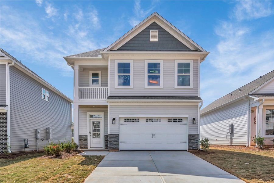 Front exterior of a new home in Brownstone Park, Easley, SC, highlighting curb appeal (Image 1).