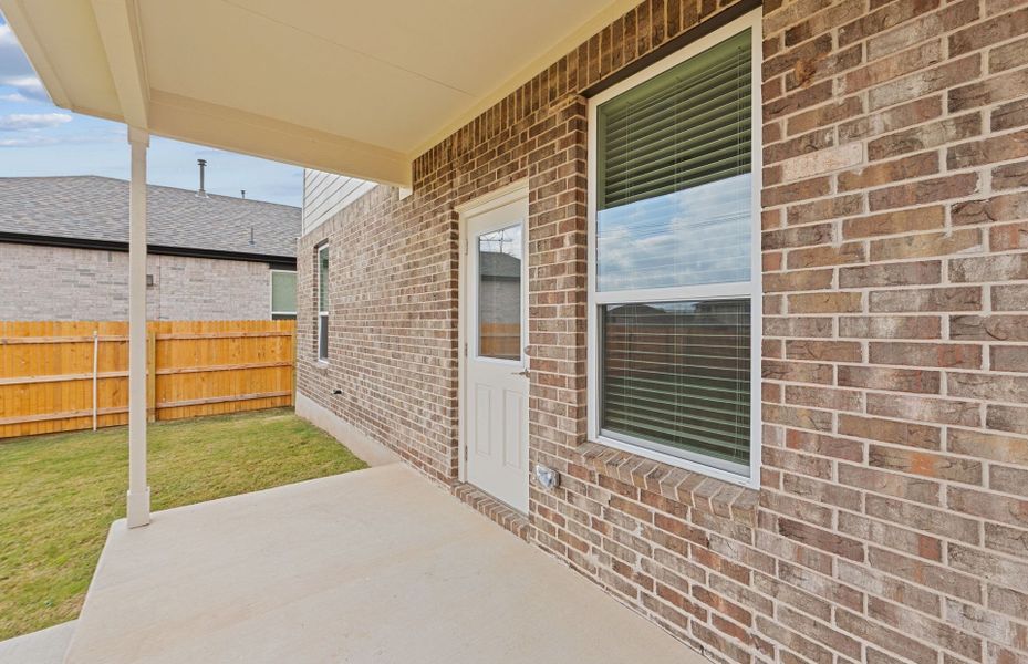 Exterior details and patio area of a home in Crosswinds, Kyle (Image 20).