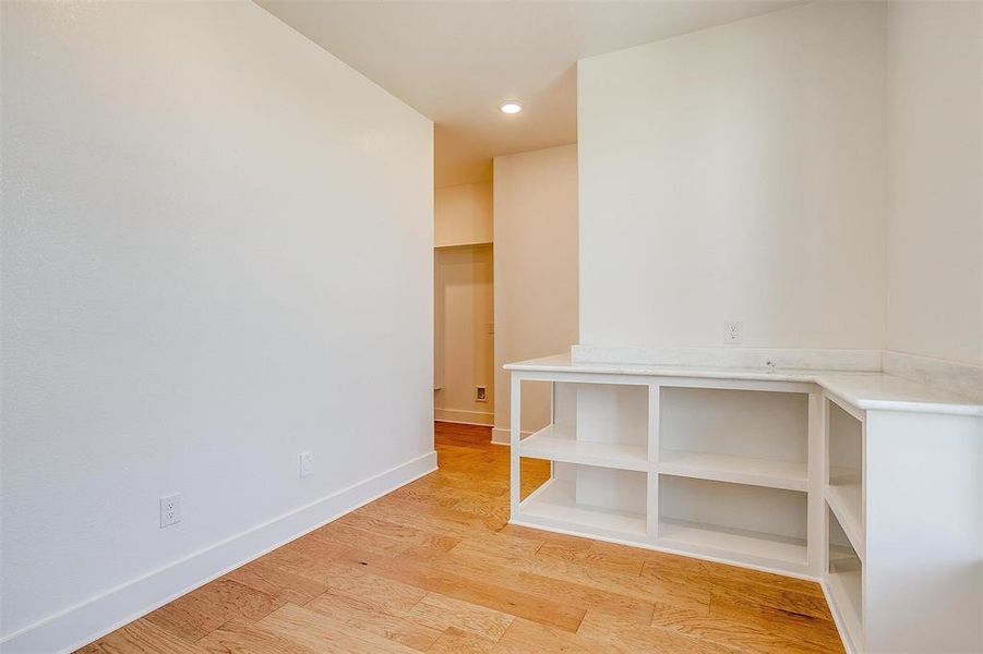 Empty room featuring light wood-type flooring