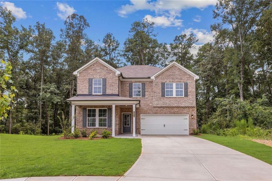 Front exterior of a new home in Oak Grove Glen, Snellville, GA, highlighting curb appeal (Image 1). Front exterior of a new home in Oak Grove Glen, Snellville, GA, highlighting curb appeal (Image 1).