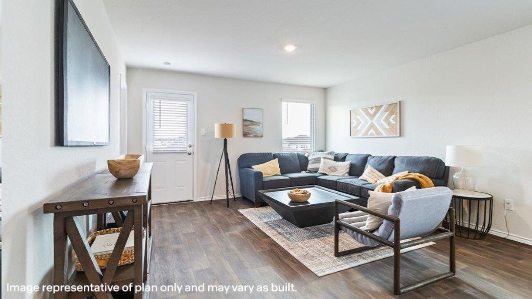 Hardwood-style flooring extends throughout this naturally illuminated living space, creating a harmonious and functional area. Hardwood-style flooring extends throughout this naturally illuminated living space, creating a harmonious and functional area.