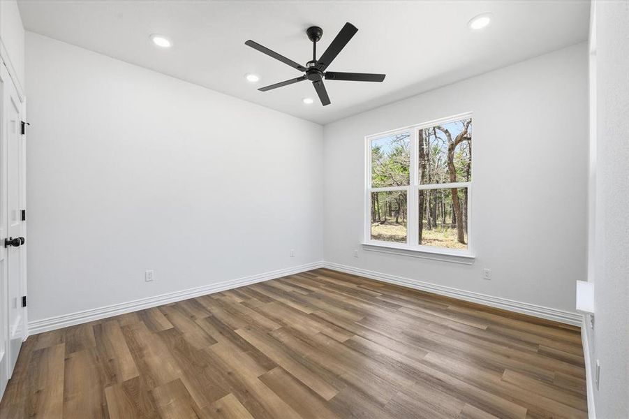 Unfurnished room with recessed lighting, dark wood finished floors, and a ceiling fan