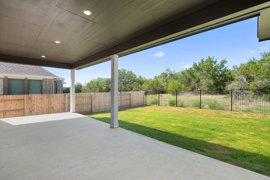 Exterior details and patio area of a home in Lariat, Liberty Hill (Image 30).