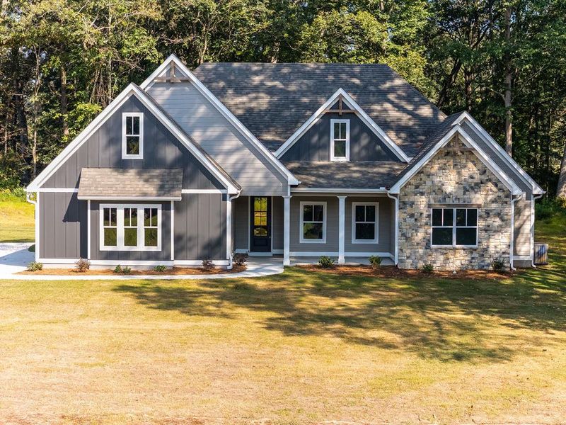 Front exterior of a new home in LOVVORN ESTATES, Carrollton, GA, highlighting curb appeal (Image 23).