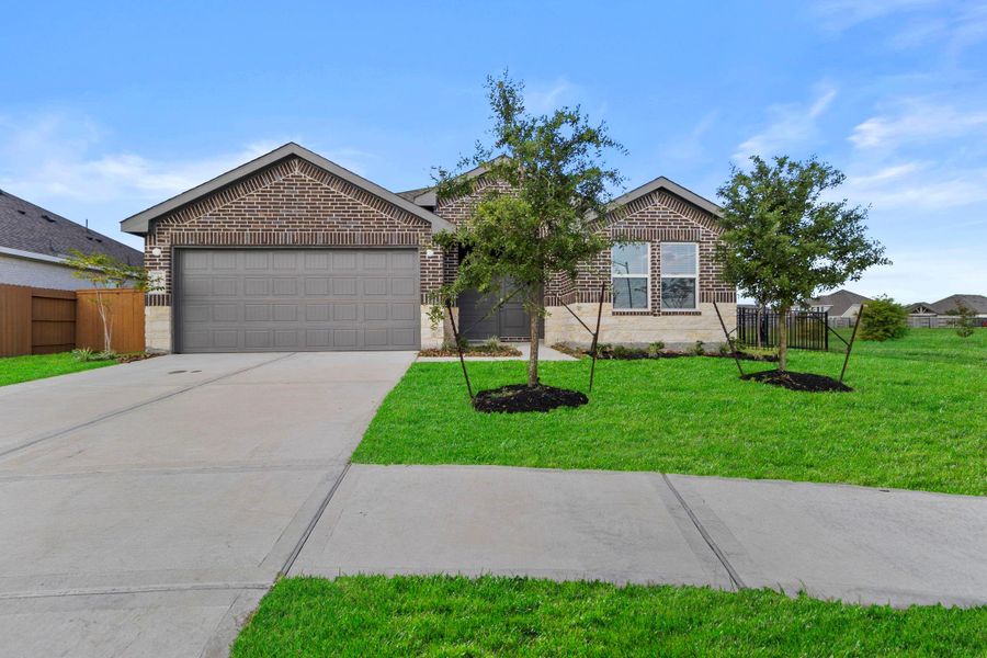 Front exterior of a new home in , Dayton, TX, highlighting curb appeal (Image 1). Front exterior of a new home in , Dayton, TX, highlighting curb appeal (Image 1).