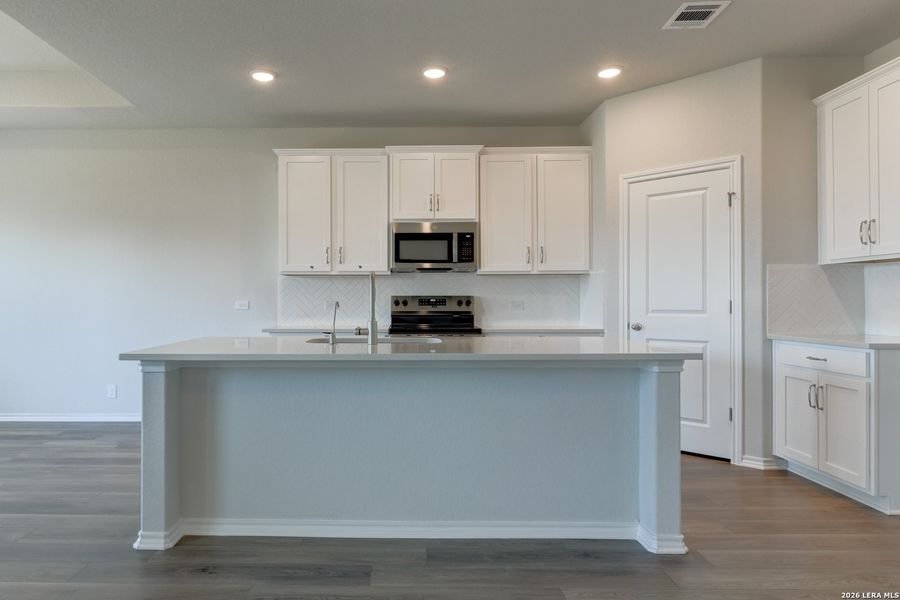 Furnished interior view inside a new home in Hennersby Hollow, San Antonio (Image 6).