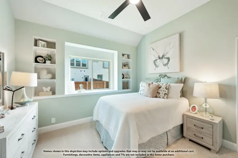 Bedroom with light green walls, built-in shelves, ceiling fan, and a large window Bedroom with light green walls, built-in shelves, ceiling fan, and a large window