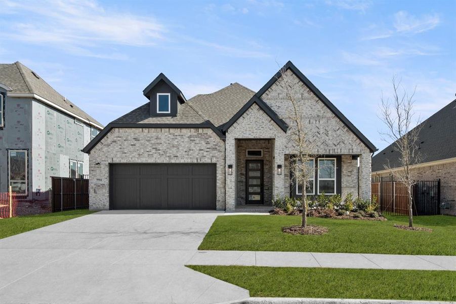 Front exterior of a new home in La Frontera, Fort Worth, TX, highlighting curb appeal (Image 22).