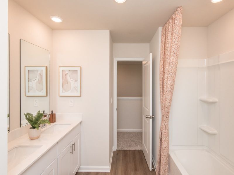 Dual sinks in the secondary bathroom make mornings a breeze.