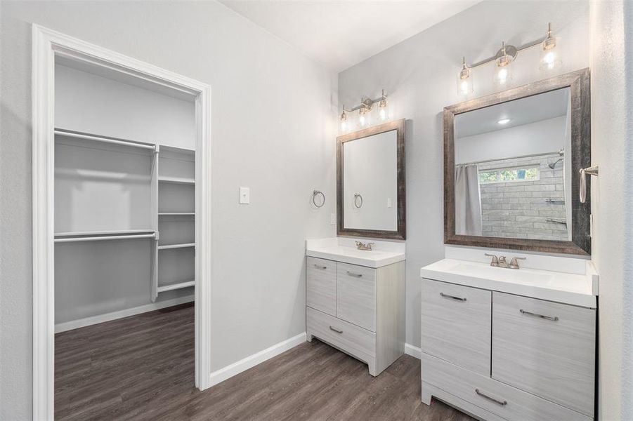 Bathroom with vanity, hardwood / wood-style flooring, and a shower with curtain