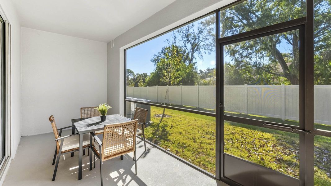 Exterior details and patio area of a home in The Gardens at Bay Street, Sarasota (Image 3).