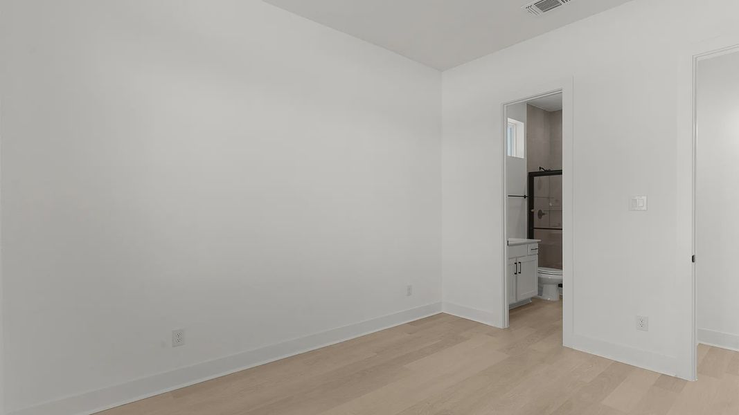 Representative unfurnished interior of a home built from the Cornell by Chesmar Homes in Crescent Bluff, Georgetown (Image 11).