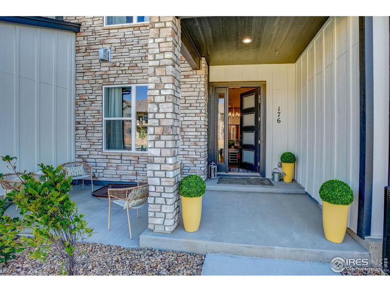 Exterior details and patio area of a home in Highlands at Fox Hill - The Towns, Longmont (Image 2).