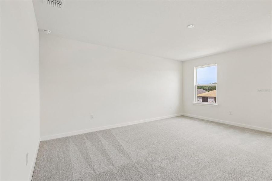Spacious, unfurnished interior of a new home in Grasslands West, Lakeland (Image 15).