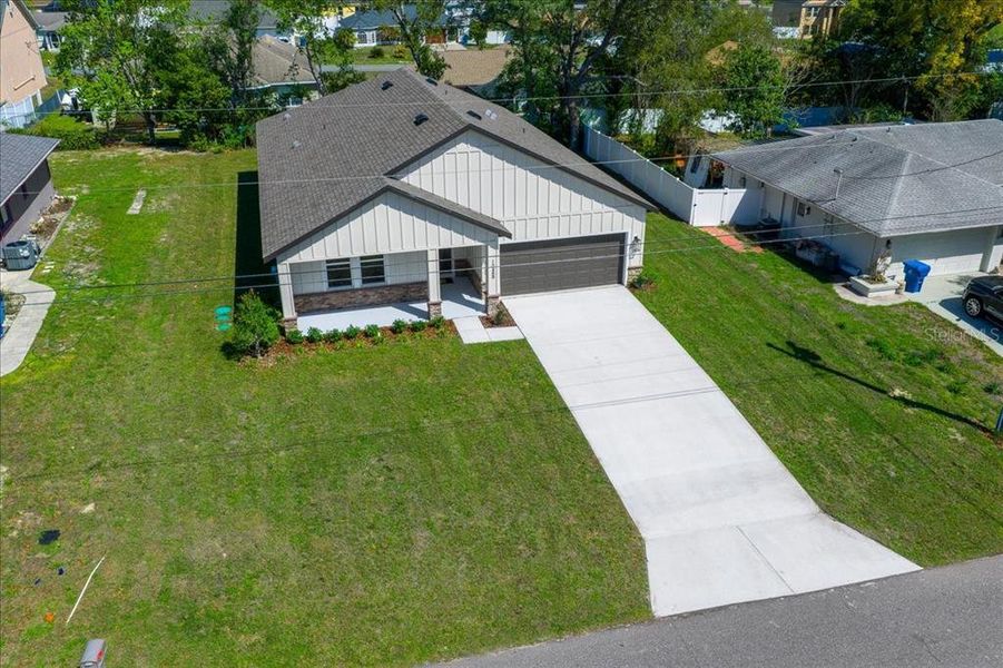 Front exterior of a new home in , Spring Hill, FL, highlighting curb appeal (Image 27).