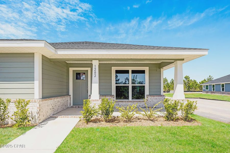 Front exterior of a new home in East Bay, Panama City, FL, highlighting curb appeal (Image 15).