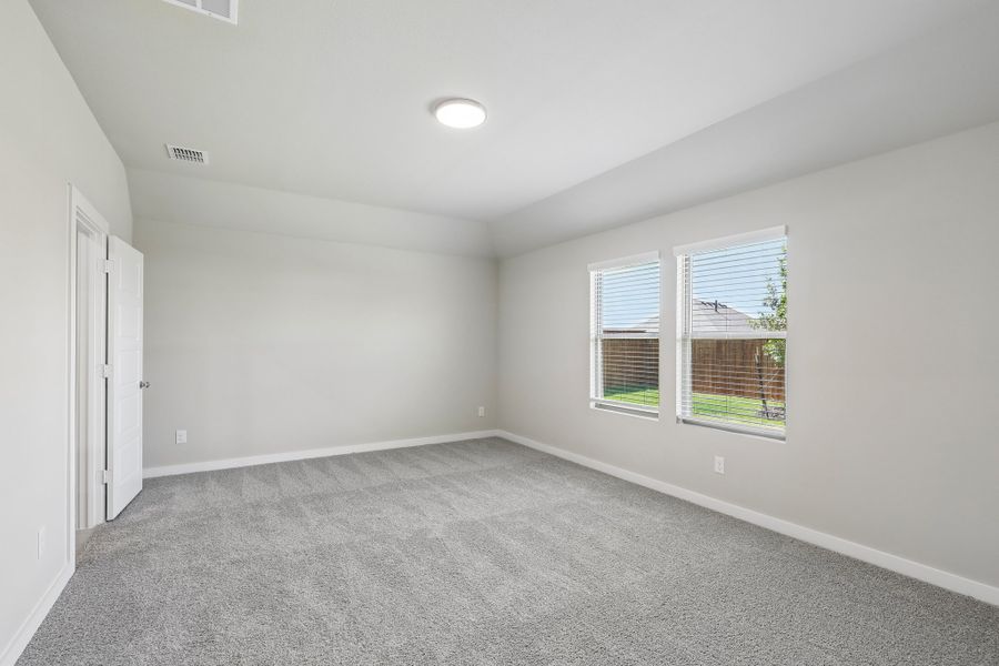 Primary Bedroom in the Oscar home plan by Trophy Signature Homes