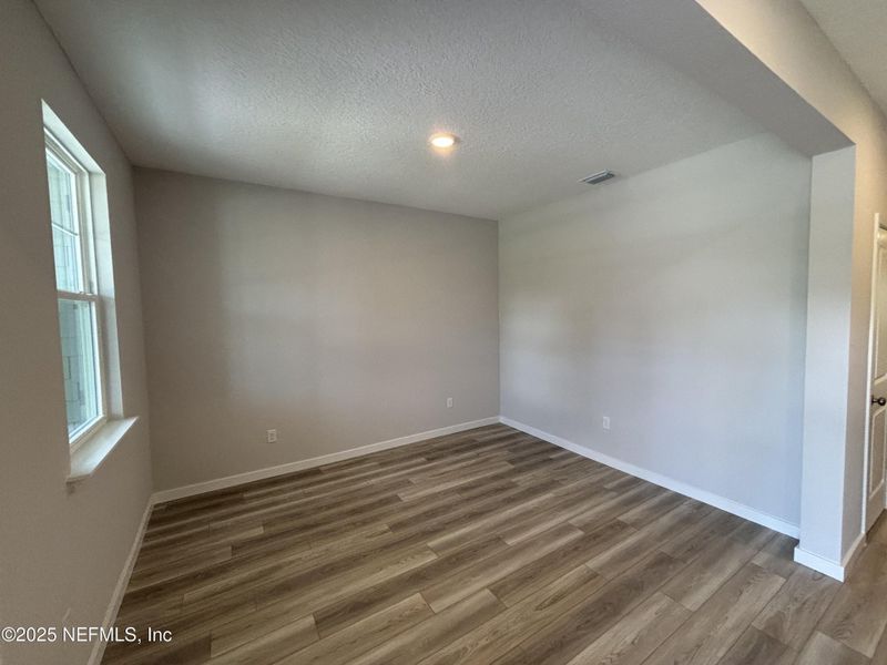 Spacious, unfurnished interior of a new home in The Cypress Series at Reserve East, Flagler Beach (Image 9).