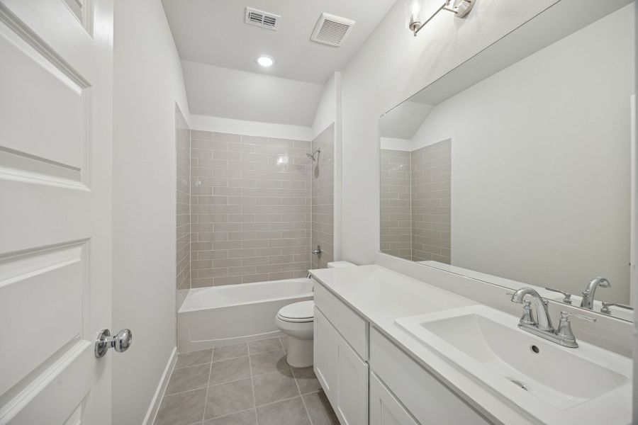 Bathroom in the Wimbledon home plan by Trophy Signature Homes – REPRESENTATIVE PHOTO