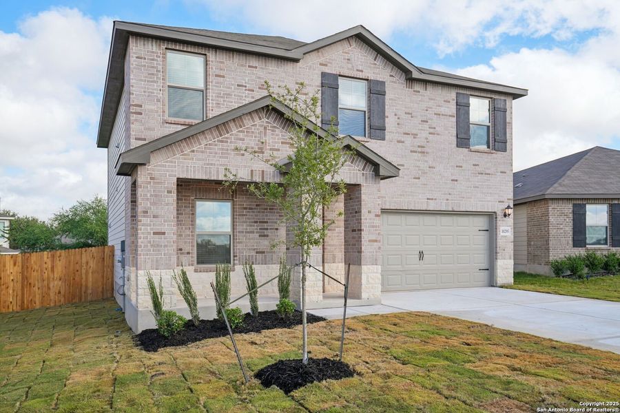 Front exterior of a new home in Royal Crest, San Antonio, TX, highlighting curb appeal (Image 22).