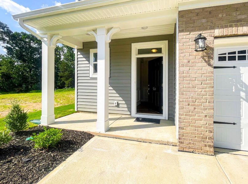 Front exterior of a new home in Fairview Village Townhomes, Simpsonville, SC, highlighting curb appeal (Image 2). Front exterior of a new home in Fairview Village Townhomes, Simpsonville, SC, highlighting curb appeal (Image 2).