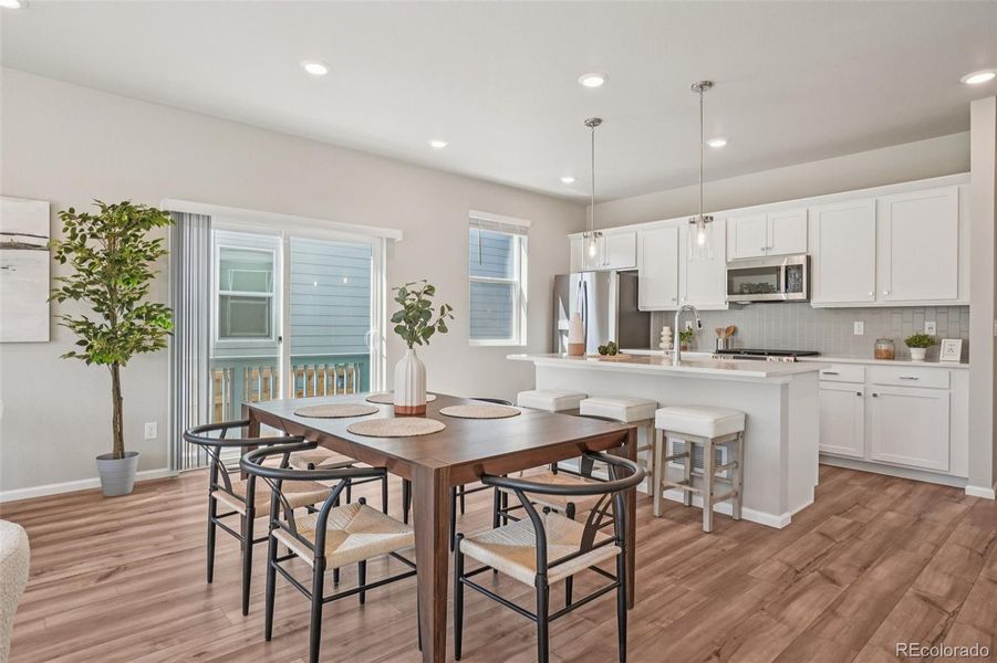 Furnished interior view inside a new home in Woodrose at Painted Prairie, Aurora (Image 3).